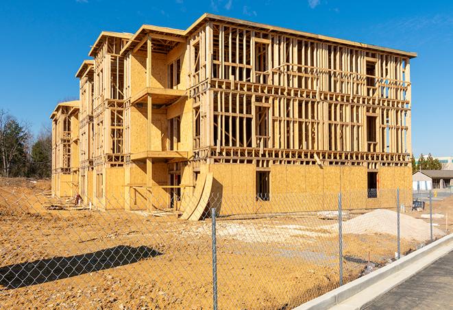 a snapshot of temporary chain link fences protecting a large construction project from unauthorized access in Nesconset NY